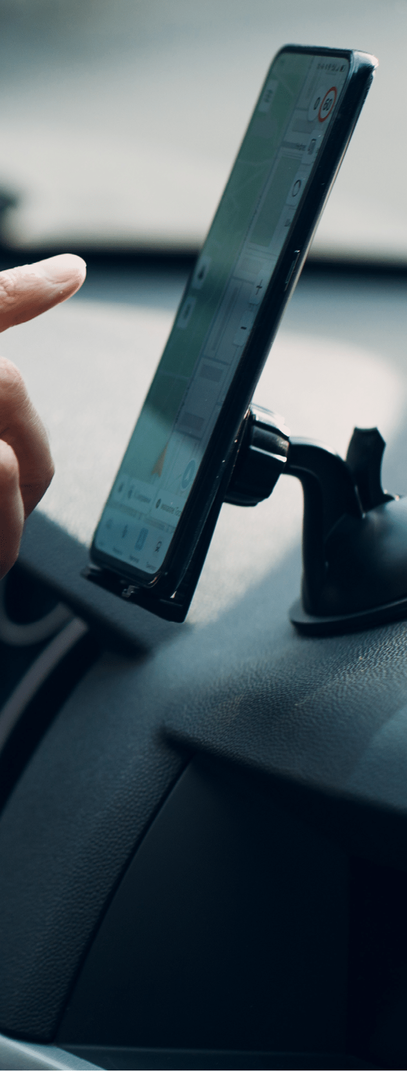 Navigator in car vehicle transportation commuter. Driver man pointing hand finger mobile phone navigator app while driving car.