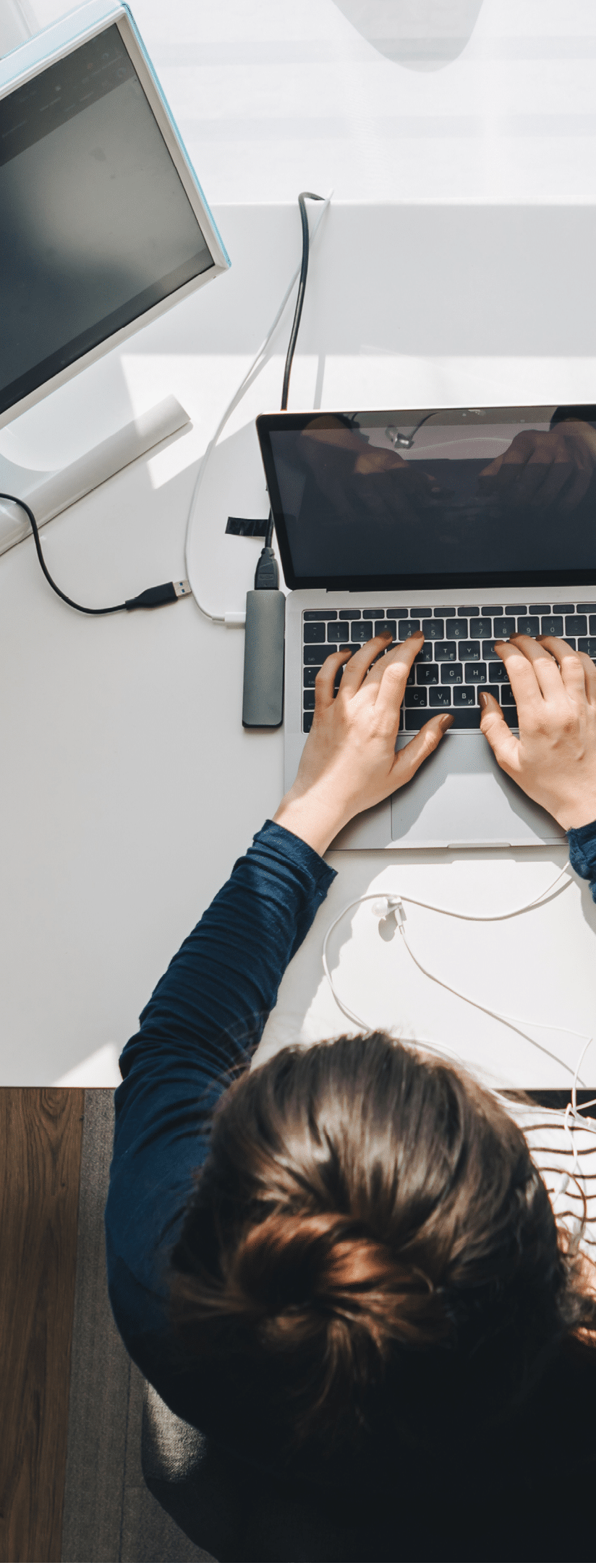 woman working on laptop at home. telework. freelance concept. overhead view