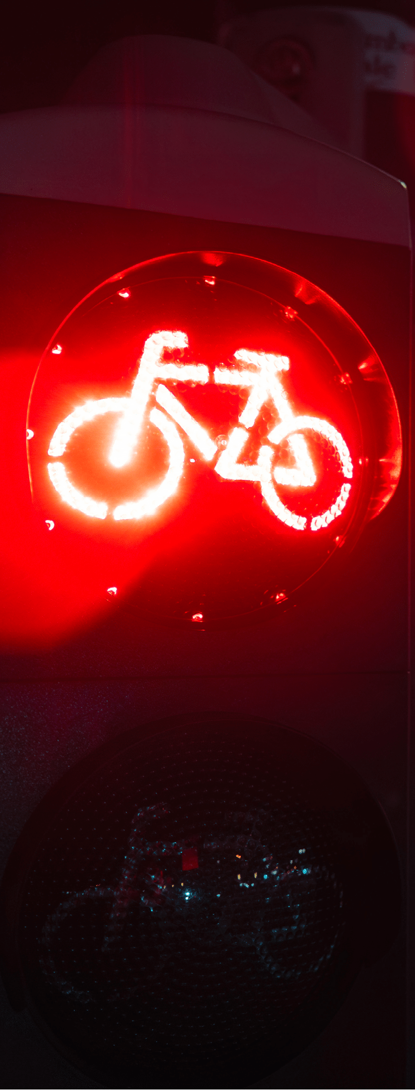 Bicycle stop red warning lamp sign on traffic light road highway driveway drive crossroad intersection evening dark time german city. Bike forward movement prohibited on semaphore signal city street.